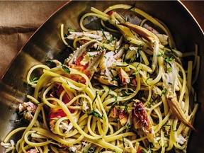 For a dramatic presentation, arrange chef Andrew Richardson' Linguine with Dungeness Crab, Lemon, Chili and Tomato on a platter and garnish with crab claws.