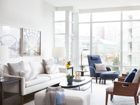 Interior designer Falken Reynolds chose a soft neutral palette for this Olympic Village condo. Colourful pieces such as the B&B Italia chair pull out tones of blue from the client’s impressive art collection including photos of Moscow subway stations.