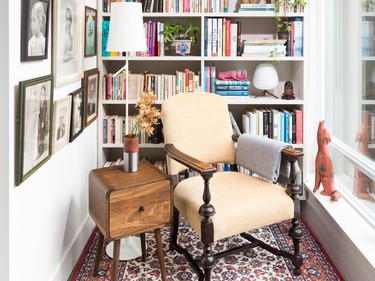 A comfortable antique chair is given a new lease on life with soft yellow upholstery in the light-filled reading nook.