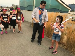 Running Tours Inc. of Vancouver named Little Harley Quinn, right, as the Best Costume Award winner following the inaugural Big Superhero Run last Saturday in Richmond.