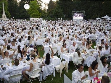 A toast and the waving of napkins officially starts the 7th Annual Le Dîner en Blanc at the VanDusen Botanical Garden in Vancouver on Thursday.