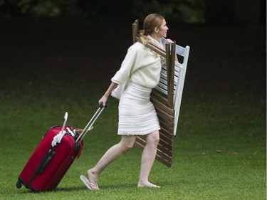 A woman arrives at the 7th Annual Le Dîner en Blanc  at the VanDusen Botanical Garden in Vancouver on Thursday.