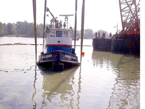 The George H. Ledcor tugboat has been lifted out of the Fraser River.