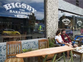 Isabelle Mumby and Matt Gilbert enjoy a lunch on a bench outside Bigsby The Bakehouse,  Vancouver, August 11 2018.