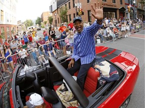 Baseball Hall of Famer Ozzie Smith rides as the grand marshal of the Little League Grand Slam Parade on Wednesday in downtown Williamsport, Pa. The Little League World Series, featuring 16 teams from around the world (including Whalley), starts Thursday in South Williamsport, Pa.
