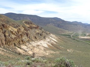 The McAbee fossil site, eight kilometres east of Cache Creek in the Thompson River valley, is the light coloured shales exposed on the hillside on the left.