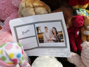 A photograph sits amid the tributes as they grow outside the home where a pregnant woman, Shanann Watts, and her two daughters, Bella and Celeste, lived Thursday, Aug. 16, 2018, in Frederick, Colo.