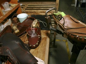 FILE - This Aug. 11, 2010, file photo, shows shoes at the research and development room of Timberland Company in Stratham, N.H. VF Corp. says it plans to split into two publicly traded companies, with one focusing on clothing and footwear and the other concentrating on jeans and its outlet businesses. VF Corp., which is honing in on activity-based outdoor, active and work lifestyles, previously sold the Nautica brand and purchased the Altra, Icebreaker and Williamson-Dickie brands. Some of its other brands include The North Face, Timberland and Wrangler.