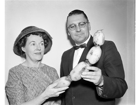 A Dick Oulton photo of an unknown woman and man checking out some fruit at the B.C. Fruit Growers Association convention, circa 1950s/60s.