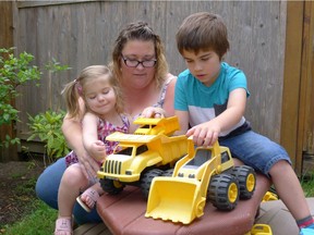 Susie Clark and two of her three children — Adam, 7, and Karis, 2 — play in their back yard in Langley. Clark is concerned that her daycare is hiking fees for the second time in a year, reducing the amount of money she could be saving with the province's Child Care Fee Reduction Initiative.