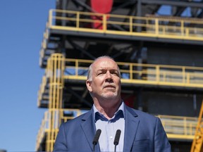 Premier John Horgan announces a Community Benefits Agreement during a press conference outside the ironworkers training facility at BCIT in Burnaby in July 2018.