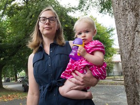 Sheila Louis, with daughter Annabelle, 1, is frustrated that the city is ignoring calls to control aphids in the 500-block East 21st Street in Vancouver.