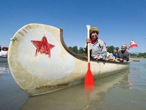 Julie Kell from the Fort Langley Canoe Club takes part of the arrival of the fur brigades on Monday during Brigade Days in Fort Langley.