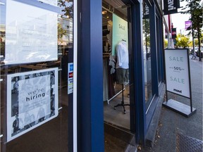 Help wanted signs along West 4th Ave. in Vancouver.