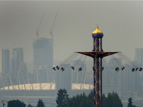 Downtown Vancouver seen in the haze behind The Atmosfear ride at the PNE  in Vancouver, BC., August 13, 2018.