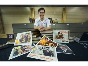 Spencer Dodd of Able Auctions with some of the movie lobby cards from the Clark Howard collection.
