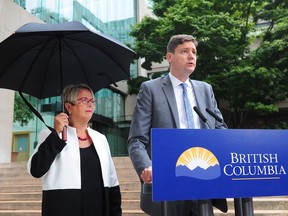 Attorney General David Eby and Judy Darcy, Minister of Mental Health and Addictions, at a press conference at B.C. Supreme Court in Vancouver, August 29, 2018. The provincehas launched a class action lawsuit against opioid drug companies, whose marketing practices have had devastating impacts on the lives of thousands of British Columbians.