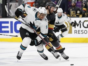 San Jose Sharks left-winger Evander Kane (9) and Vegas Golden Knights defenceman Colin Miller (6) vie for the puck during Game 5 of an NHL second-round playoff series on May 4 in Las Vegas.