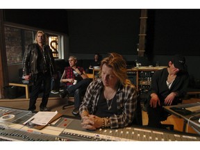 Randy Rampage (left) in a 2008 recording session with DOA and producer Bob Rock (at board). DOA's Joe Keithley is beside Rampage.