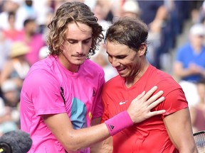 Rafael Nadal of Spain, right, congratulates Stefanos Tsitsipas of Greece after defeating him to win the championships men's finals Rogers Cup tennis action in Toronto on Sunday, August 12, 2018.