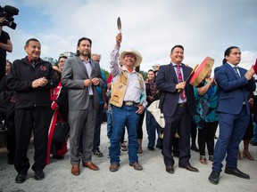 Coldwater Indian band Chief Lee Spahan raises an eagle feather before he and other First Nations leaders respond to a Federal Court of Appeal ruling on the Kinder Morgan Trans Mountain Pipeline expansion. In a unanimous decision by a panel of three judges, the court said the National Energy Board's review of the project was so flawed that the federal government could not rely on it as a basis for its decision to approve the expansion.