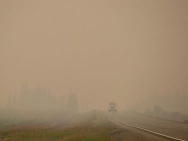 Thick smoke from wildfires fills the air as a motorist travels on Hwy. 27 between Vanderhoof and Fort St. James, B.C., on Wednesday, August 15, 2018. The British Columbia government has declared a provincial state of emergency to support the response to the more than 500 wildfires burning across the province.