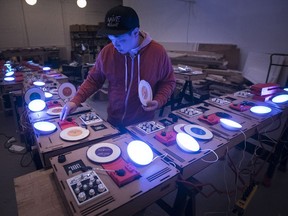DJ Kid Koala tries out the homemade turntables which will be part of his upcoming show.