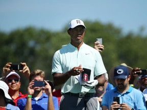 Tiger Woods of the United States plays his shot from the 12th tee during the first round of the BMW Championship at Aronimink Golf Club on September 6, 2018 in Newtown Square, Pennsylvania.