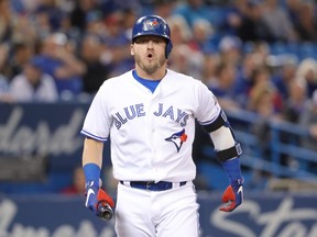 Josh Donaldson #20 of the Toronto Blue Jays reacts after fouling a ball off his leg in the first inning during MLB game action against the Boston Red Sox at Rogers Centre on May 12, 2018 in Toronto, Canada.