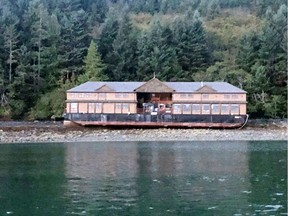 A floating fishing lodge that ran aground near the village of Queen Charlotte, B.C. is seen in this undated handout photo. The company that owns a floating fishing lodge that ran aground in British Columbia near the Haida Gwaii village of Queen Charlotte says it poses no current environmental threat.