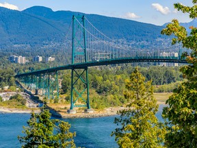 The Lions Gate, or First Narrows, Bridge near Stanley Park with North Vancouver and mountains in the background.