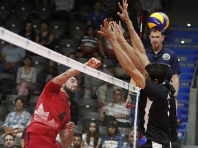 Canada's Nicholas Hoag spikes the ball on Thursday, Sept. 13, 2018 in Bulgaria during Canada's world championship win over Egypt.