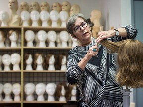 Frances Rae, manager of Eva and Company Wigs, works at the store where a collection of wigs worth more than $350,000 that were intended for cancer patients at B.C. Childrens' Hospital were stolen, in Vancouver, on Wednesday September 12, 2018. Police say at least 150 wigs worth approximately $2,500 each were taken on Friday morning.