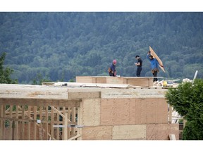 A new home is pictured being built in North Vancouver, B.C., on June, 12, 2018. Canada Mortgage and Housing Corp. says the annual pace of housing starts in August compared with July. The agency says the seasonally adjusted annual rate of housing starts was 200,986 units in August, down from 205,751 units in July.