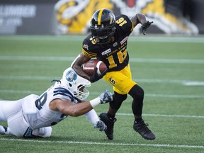 Hamilton Tiger-Cats wide receiver Brandon Banks (16) runs away from Toronto Argonauts Declan Cross (38) during first half CFL Football game action in Hamilton, Ont. on Monday, September 3, 2018. Banks wasn???t on the practice field Friday as his Hamilton Tiger-Cats prepared for a contest with the B.C. Lions.