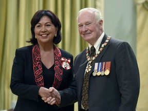 Governor General David Johnston invests Dorothy Grant, from Delta, B.C., as a Member of the Order of Canada during a ceremony at Rideau Hall on Friday, May 8, 2015 in Ottawa. Dozens of Order of Canada members from British Columbia, including Grant, are urging the federal government to cancel the Trans Mountain pipeline expansion.