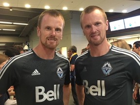 The Sedins pose in Vancouver Whitecaps jerseys for the Legends & Stars match at B.C. Place on Sept. 15, 2018.