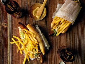 Crisp fries, crunchy slaw and tangy mustard elevate the humble hotdog in Chef Rod Butters’ lamb merguez version of a classic.