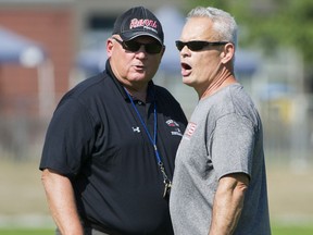 Terry Fox Ravens coaches Martin McDonnell and Tom Kudaba, left, during a practice in Port Coquitlam.