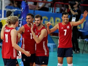 United States' team players react during a Men's world Championships volleyball match.