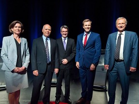 NDP Leader Jennifer McKenzie, left to right, Green Party Leader David Coon, People's Alliance Leader Kris Austin, Liberal Leader Brian Gallant and PC Leader Blain Higgs pose for photos before the start of the New Brunswick leaders debate in Riverview, N.B., Wednesday, Sept. 12, 2018.