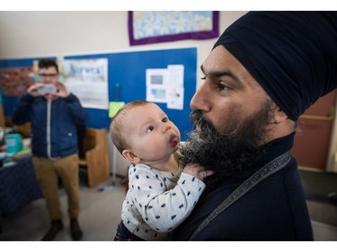 NDP Leader Jagmeet Singh holds Laurier LeSieur, 5 months, while speaking with his parents during a visit to the Rumble on Gray Street Fair, in Burnaby, B.C., on Saturday September 15, 2018. Singh is scheduled to be officially nominated as the party's candidate in the Burnaby-South byelection at a nomination meeting Saturday afternoon.