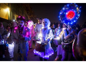 People in costumes play music while marching during the Parade of Lost Souls in Vancouver, B.C., on Saturday October 28, 2017.