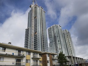 Condo towers under construction in in Metro town, where low-rise buildings, like those in the foreground, are being demolished.