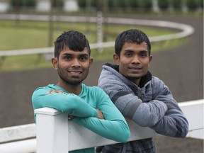 Jockeys Learie (in green) and Lenny Seecharan are 22-year old identical twins from Trinidad. The pair are now racing horses in Canada, and are pictured at Hastings Race Raceway in Vancouver.