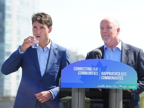 Prime Minister Justin Trudeau and B.C. Premier John Horgan make a "firm" transit announcement in Surrey on Sept. 4.