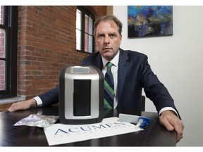 Paul Doroshenko of Acumen Law poses for a photo of the Drager Drug Test 5000 which he has purchased in Vancouver, BC, September, 5, 2018.