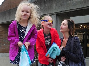 Brandee Barker, with her two daughters Nola, left, and Everly in Vancouver on Sept. 16, is disappointed after her daughters' swim lessons at the Langara YMCA were cancelled due to a shortage of instructors.