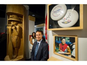 Tewanee Joseph stands beside a photo of Lara Mussell, who lead Canada to Ultimate world championships, at the new Indigenous Sport Gallery at BC Sports Hall of Fame in Vancouver, BC, Sept. 25, 2018.
