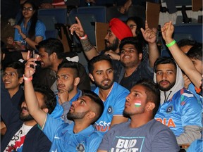 FILE PHOTO: International students of Indian and Pakistani descent gather to watch a late-night cricket match at Simon Fraser University on June 3, 2017.